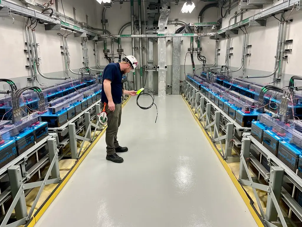 A worker checking equipment and records inside Vogtle Unit 4.